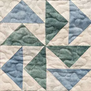 A quilt with different colored squares on it.