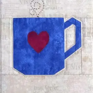 A blue coffee cup with a heart on it.