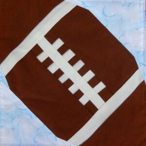 A close up of the football on a blanket