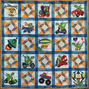 A quilt with various vehicles on it.