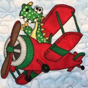 A red and green airplane with a dragon on it.