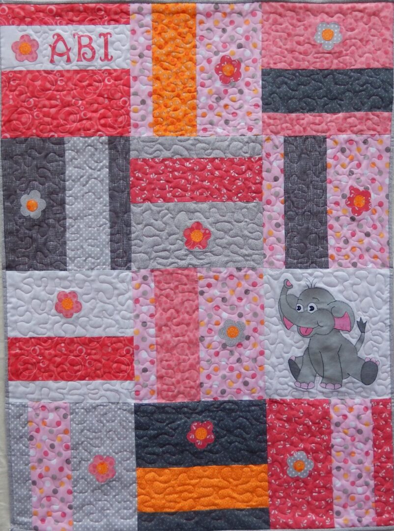 A quilt with an elephant on it