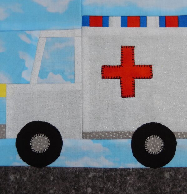 A close up of an ambulance quilt block