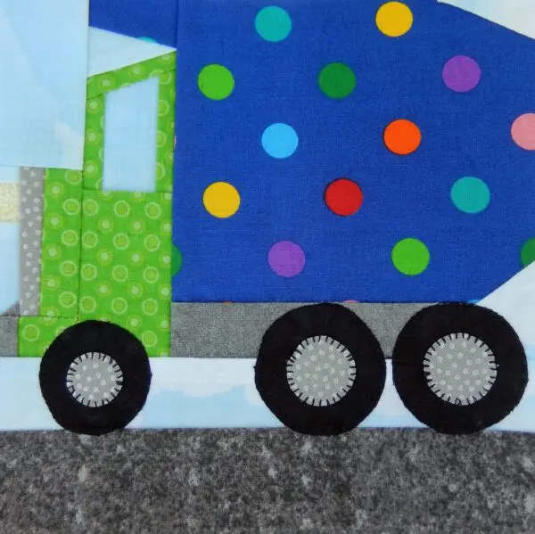 A truck with polka dots and a green body.