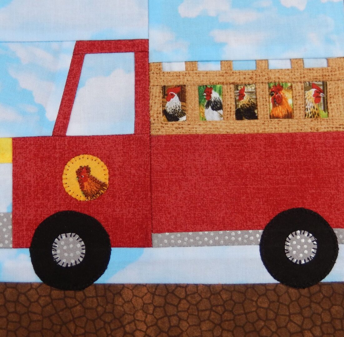 A red fire truck with chickens on the side of it.