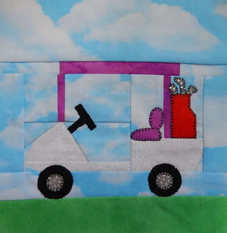 A quilt block of a golf cart with a bag and clubs.