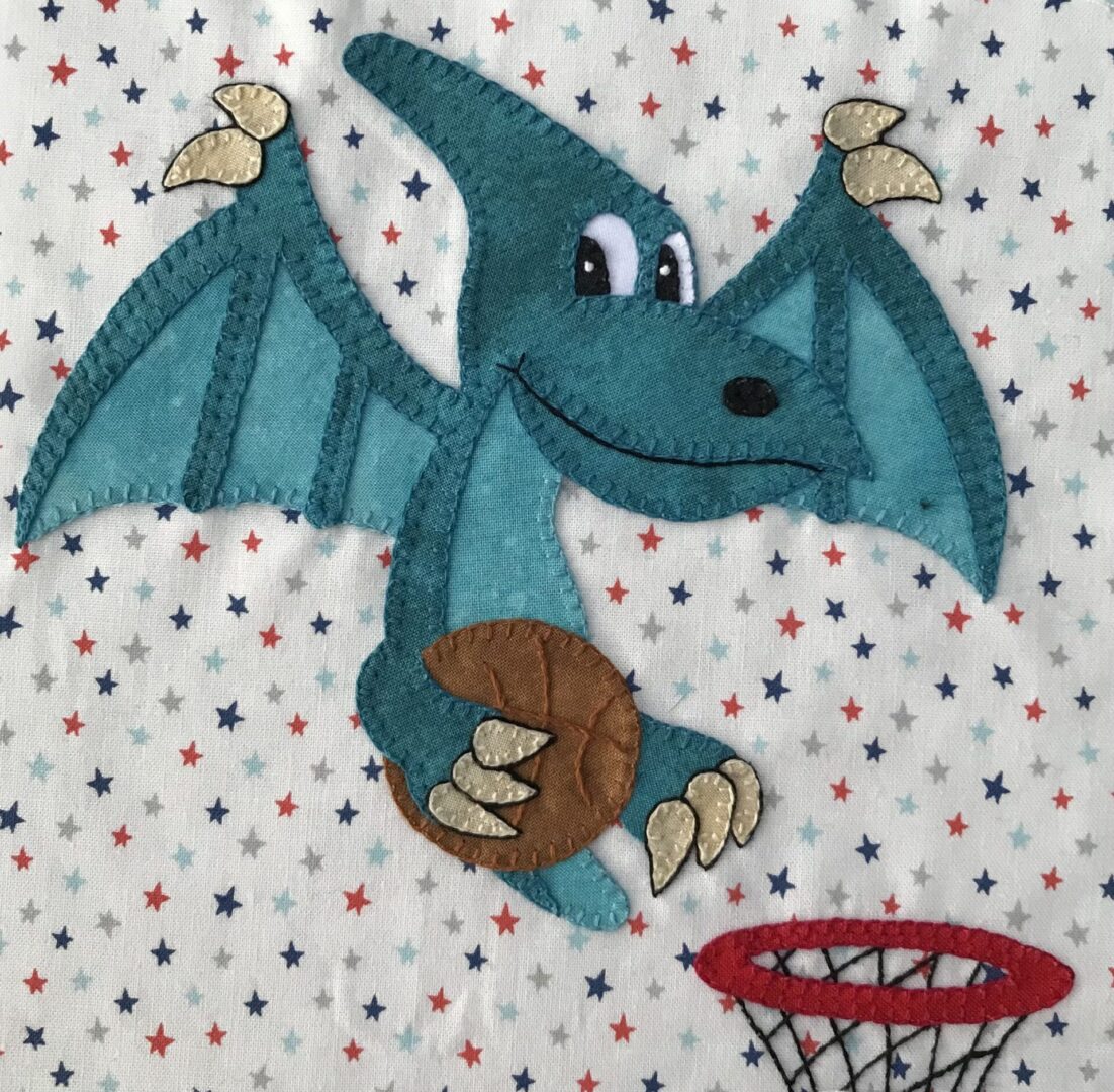 A blue dragon is playing basketball with a basket.