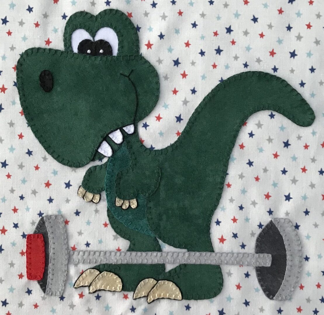 A green dinosaur is holding a weight.