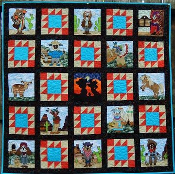 A quilt with pictures of animals and people.