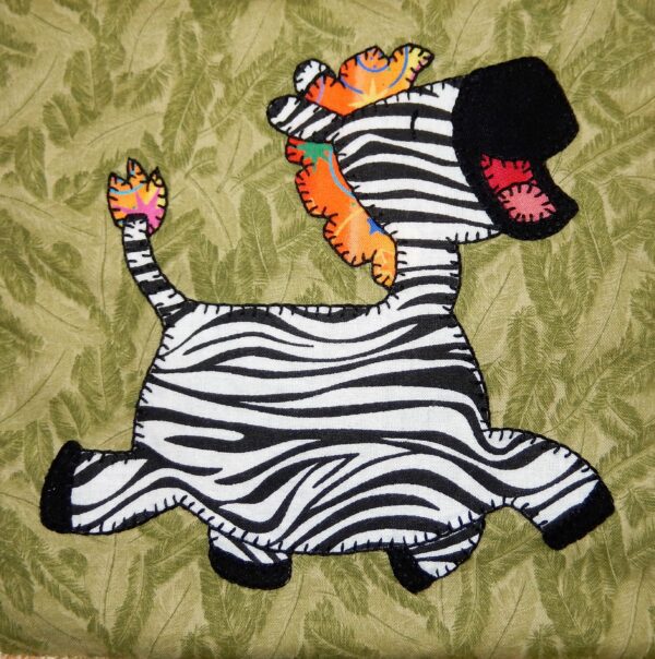 A Zebra applique on a green background.