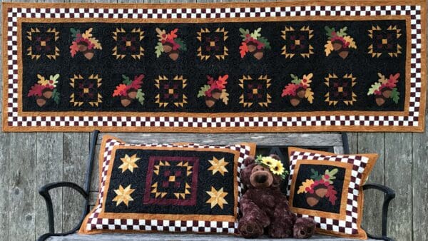 A brown teddy bear sitting on top of a table.