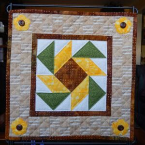 A quilt with sunflowers on it