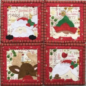 A set of four christmas coasters with santa, reindeer and elf.