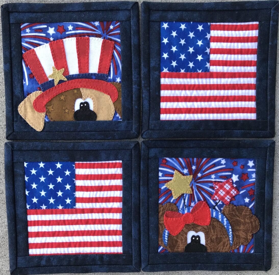 A set of four patriotic coasters with dogs and fireworks.