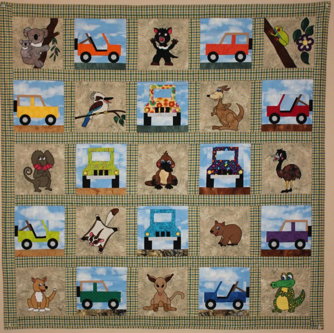 A quilt with pictures of animals and cars.