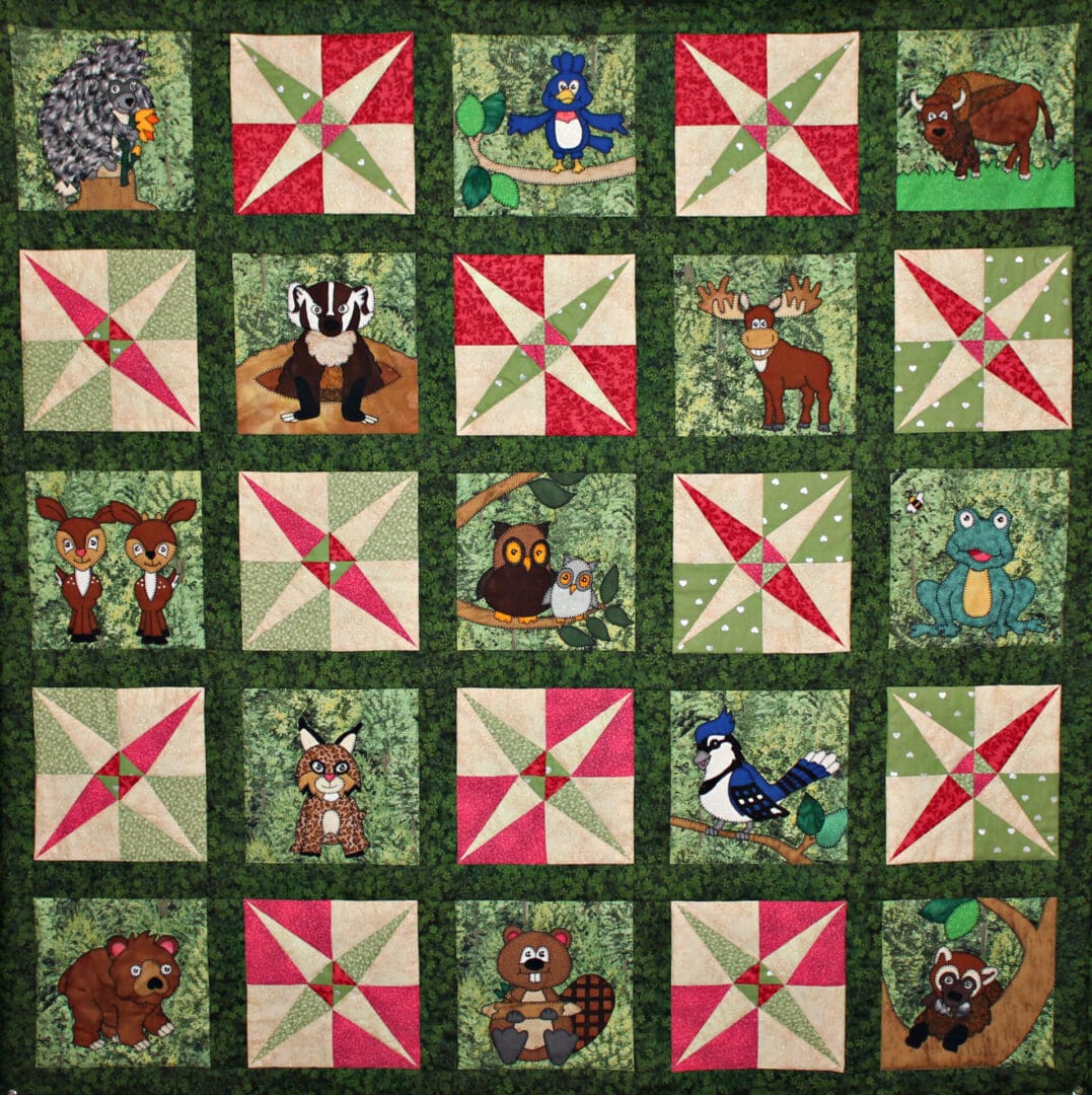 A quilt with animals and their names on it.