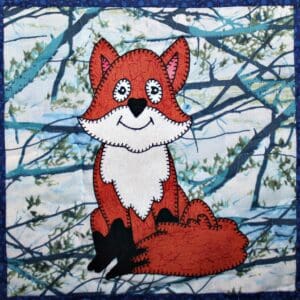 A red and white fox sitting on top of a tree.