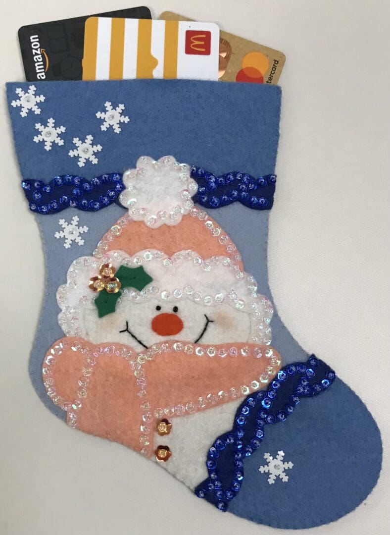 A christmas stocking with a snowman on it.
