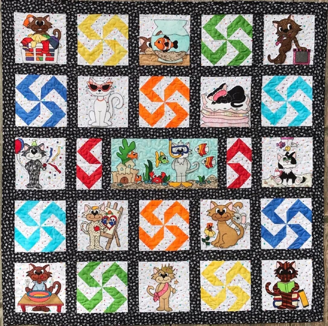 A quilt with cats and dogs on it.