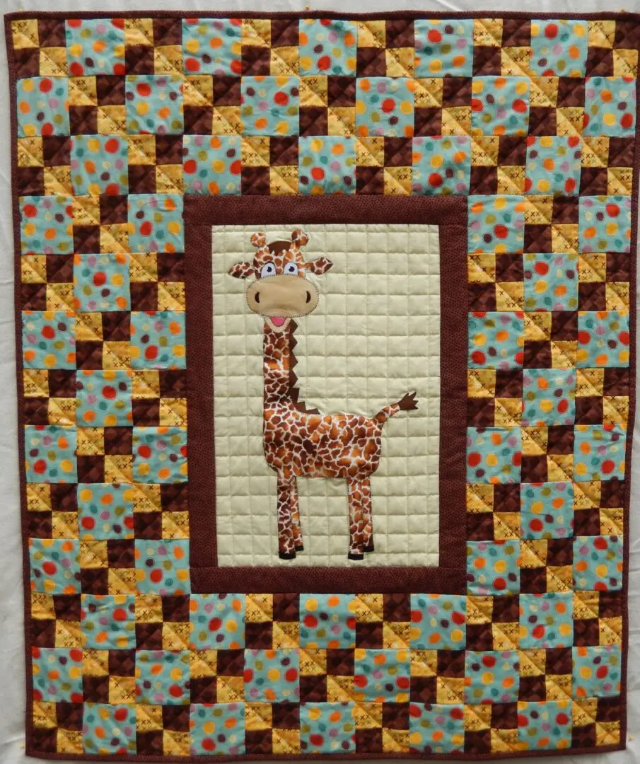 A giraffe quilt with a brown frame around it.