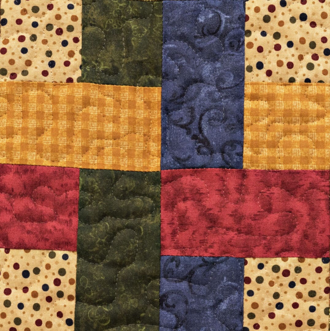 A close up of the quilt pattern