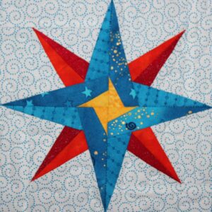 A star quilt with swirls and stars on it