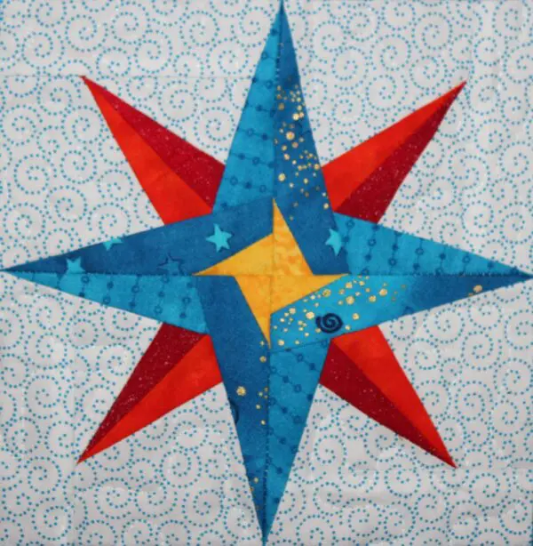 A star quilt with swirls and stars on it