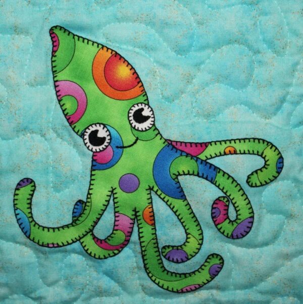 A green octopus with colorful circles on it's body.