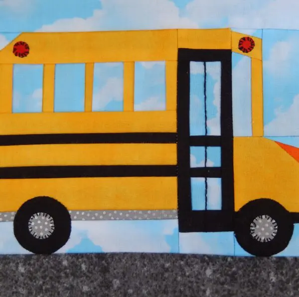 A yellow school bus with the door open.