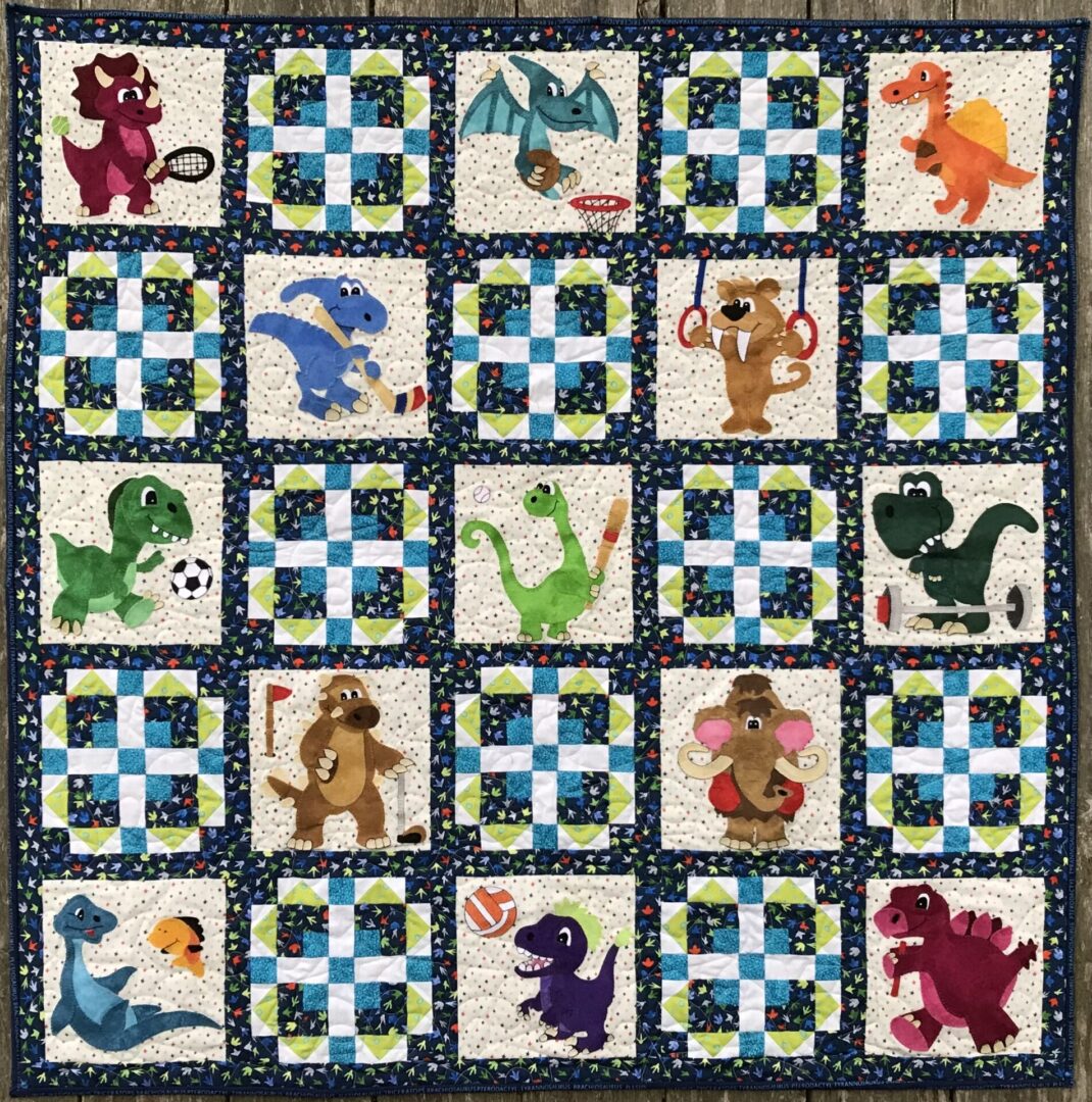 A quilt with different types of animals on it.