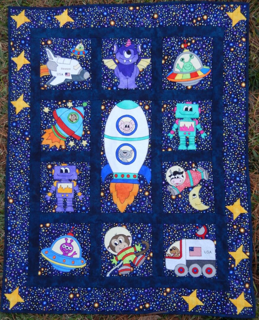 A quilt with nine different pictures of space animals.