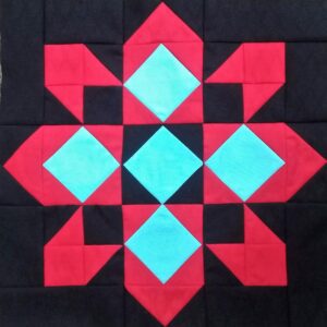 A red and black quilt with blue squares