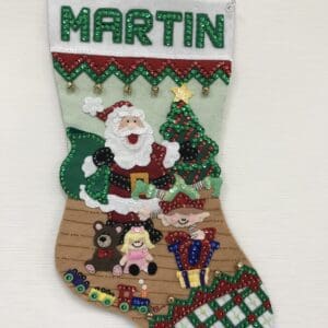 A christmas stocking with santa and other decorations.