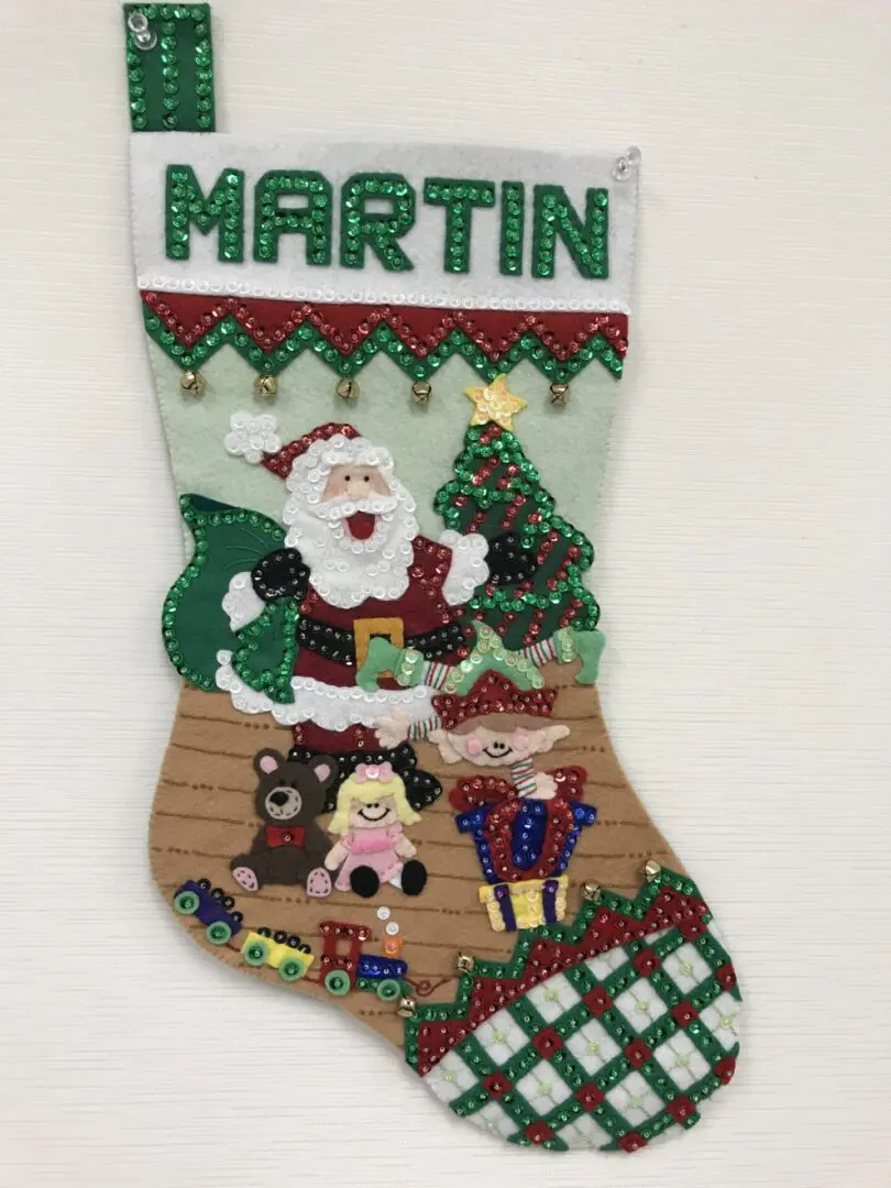 A christmas stocking with santa and other decorations.