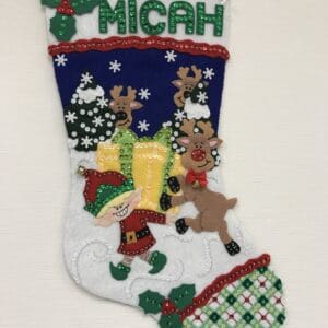 A christmas stocking with a santa clause and reindeer.
