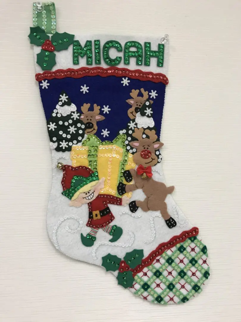 A christmas stocking with a santa clause and reindeer.
