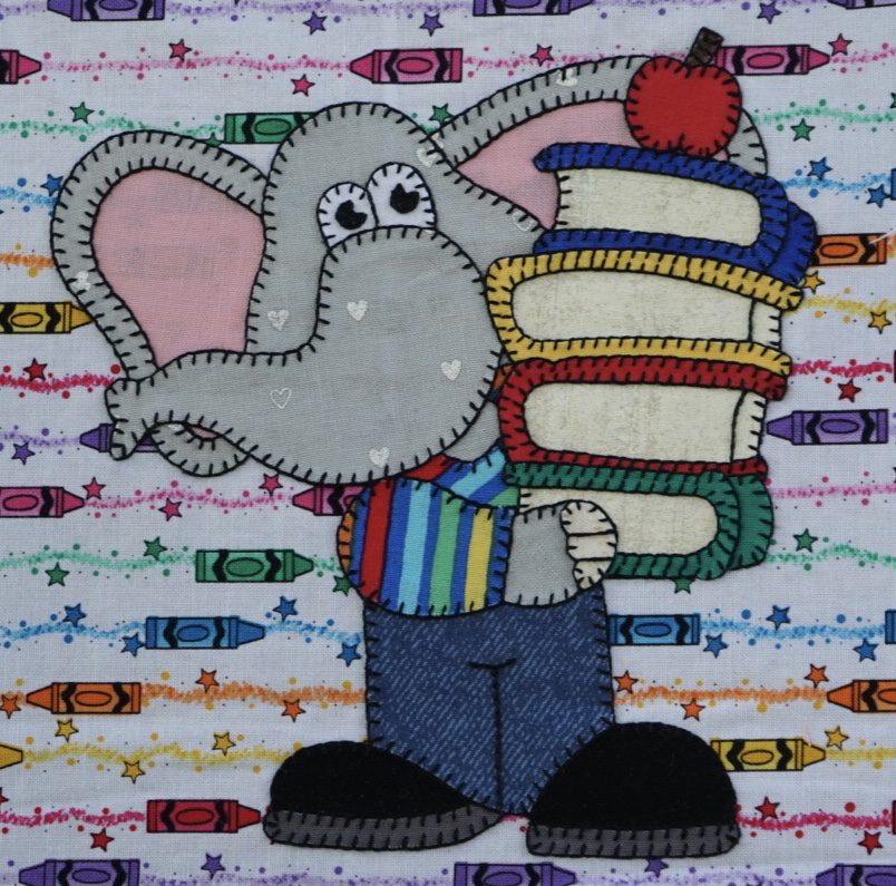 An Elephant - August holding a stack of books on a colorful background.