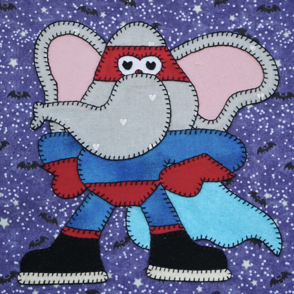 An Elephant - October in a superhero costume on a purple background.