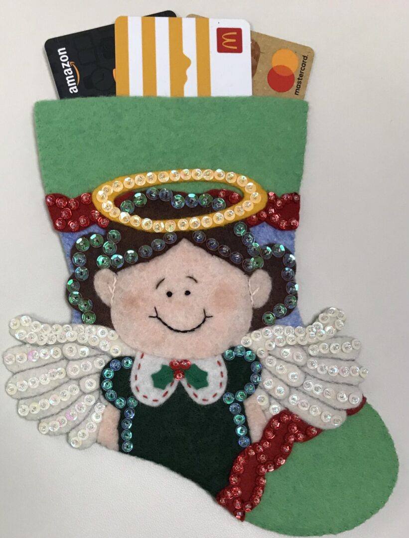 A Christmas stocking with an Angel Girl 3 Gift Card Holder.