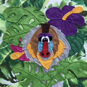 A Baboon applique in a jungle setting.