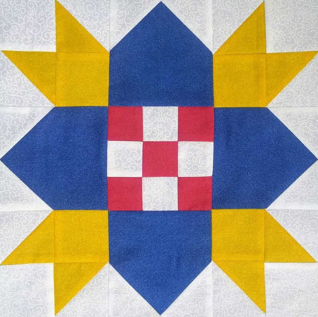 A blue and yellow Checkerboard Star quilt block with a star in the middle.