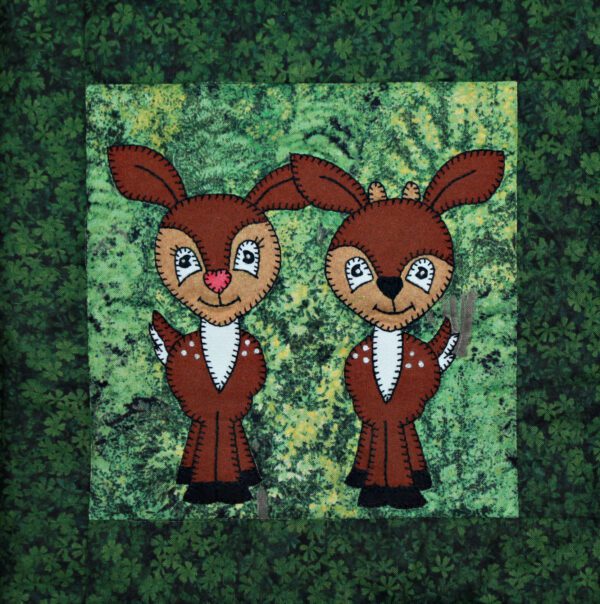 Two Deer Fawns appliqued on a green background.