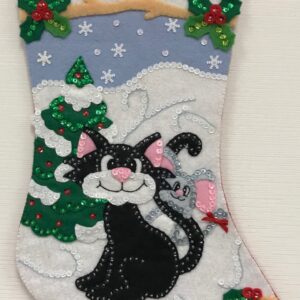 A Friendly Kitty Stocking with a black cat and a christmas tree.