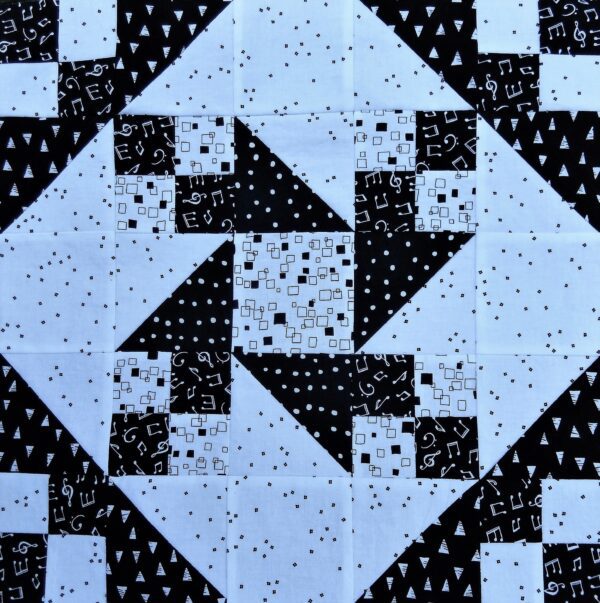 A black and white Friendship Star block with black and white squares.