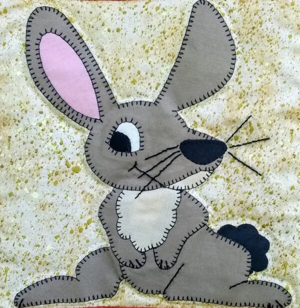 A Jackrabbit appliqued on a piece of fabric.