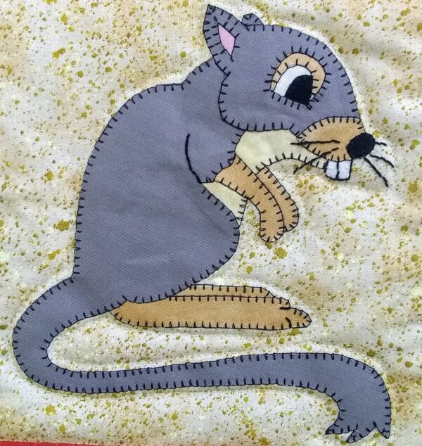 A Kangaroo Rat is embroidered on a piece of fabric.