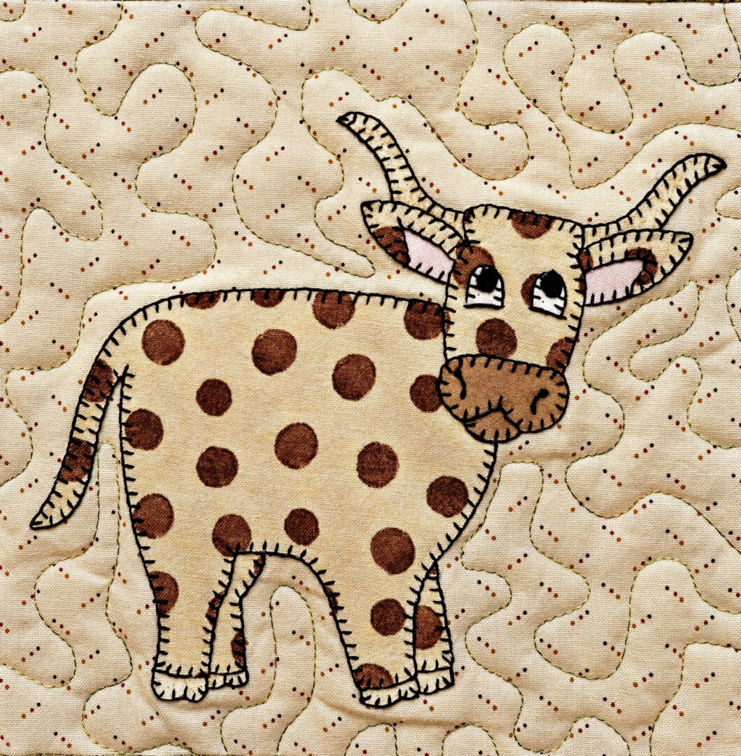 A Longhorn with polka dots on a beige background.