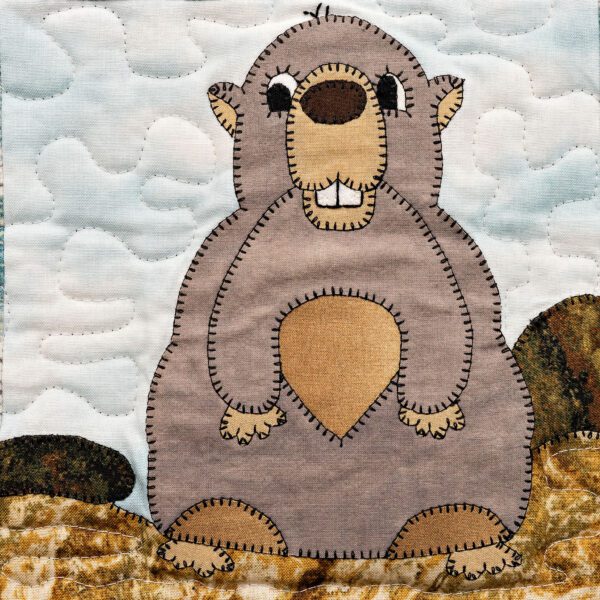 A Marmot quilt block with a Marmot on it.