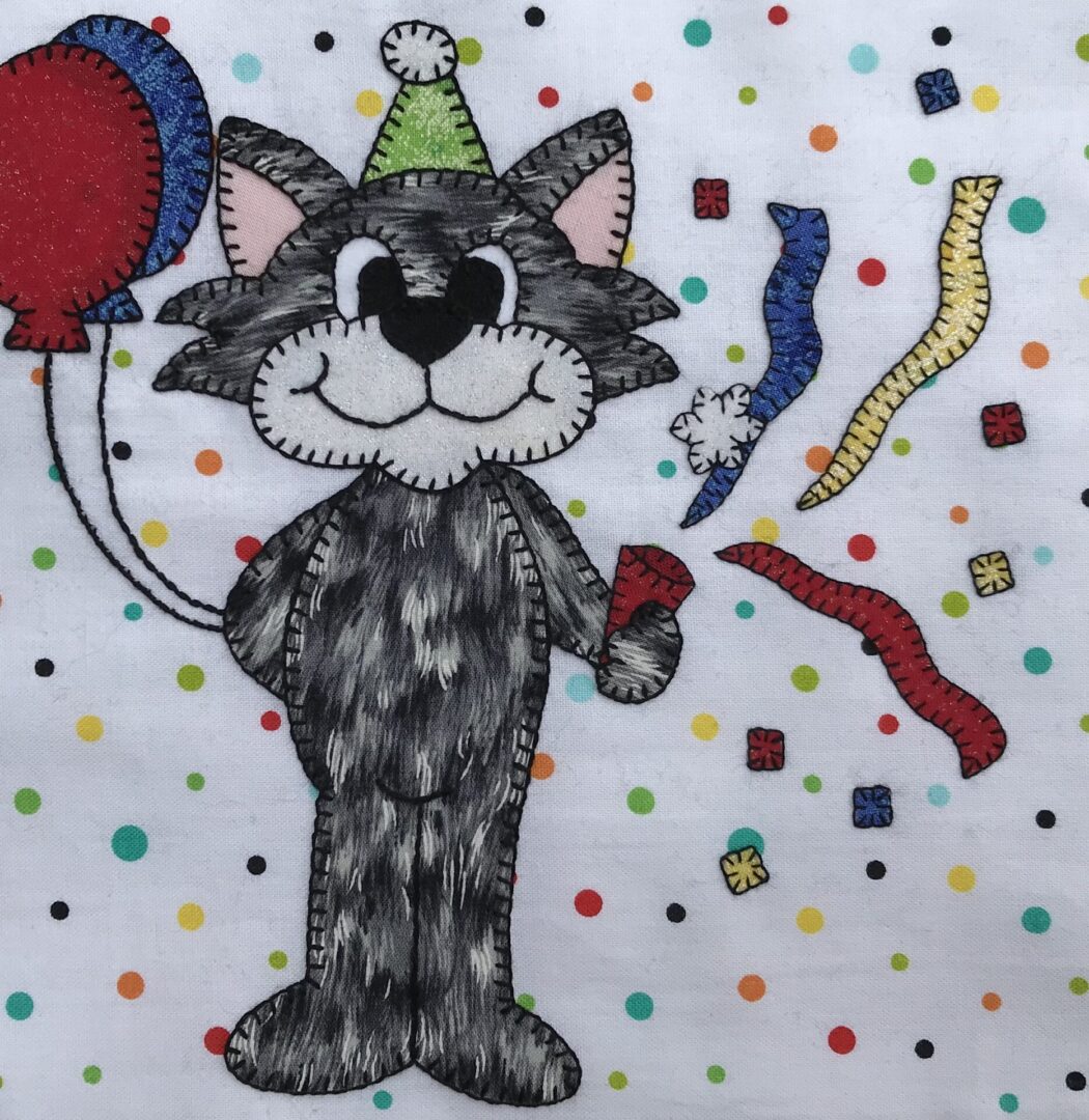 A Party Kitty with balloons and confetti.