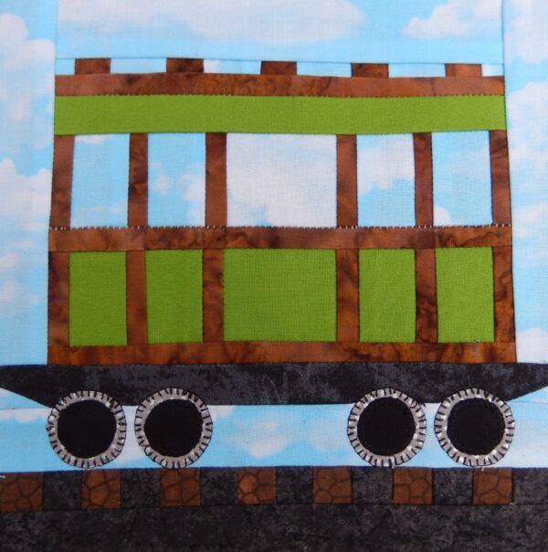 A quilt block with a Train Passenger Car on it.